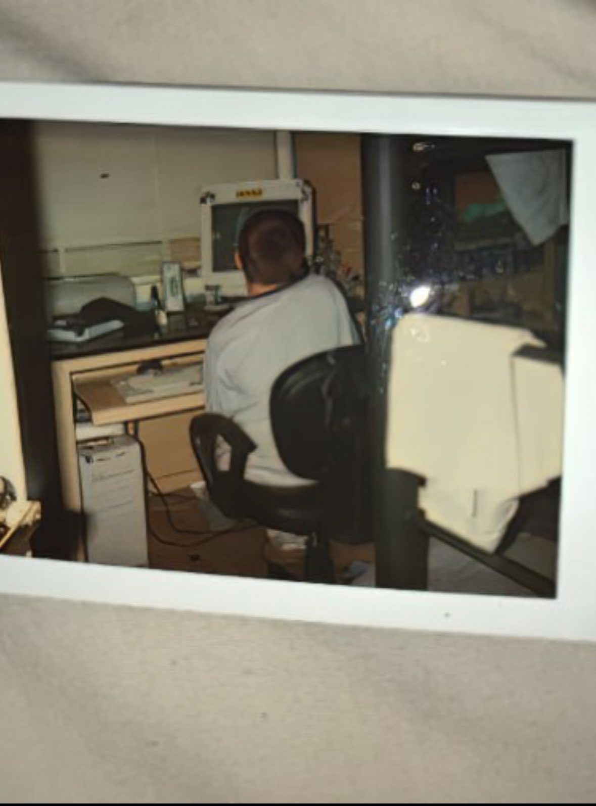 Robert DeVivo sitting at a CRT computer setup in 2001